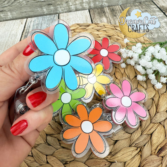 Flower badge reel with retractable reel, UV printed acrylic, colorful floral design, approximately 6 x 6 cm.