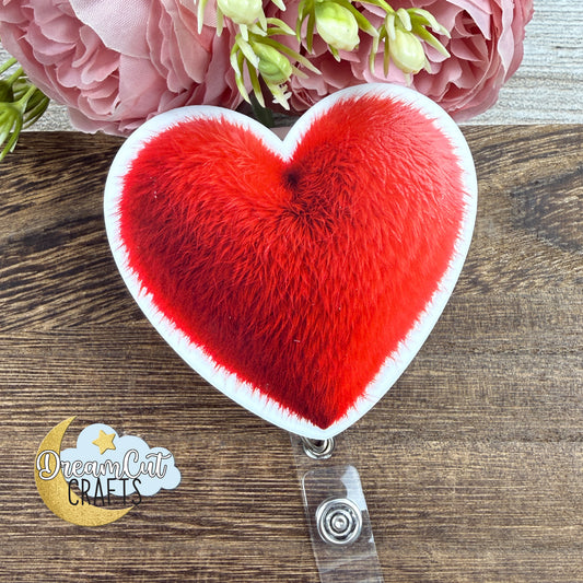 Heart-shaped badge reel top with a red textured heart design, UV printed on 3 mm white acrylic, size 7 x 6.5 cm.